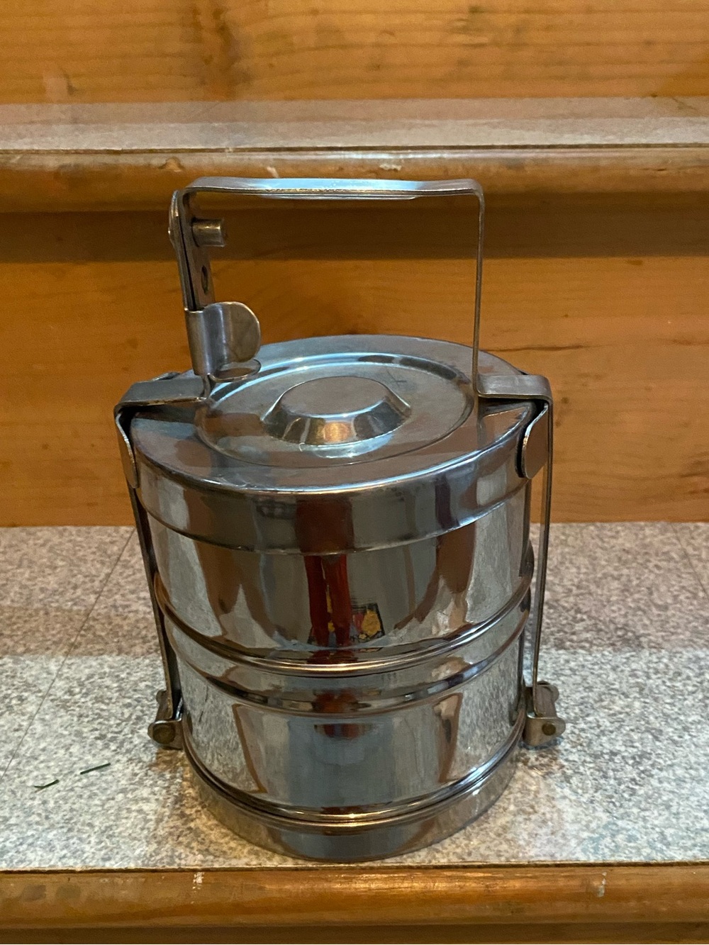 2-tier silver Tiffen with holding handle.